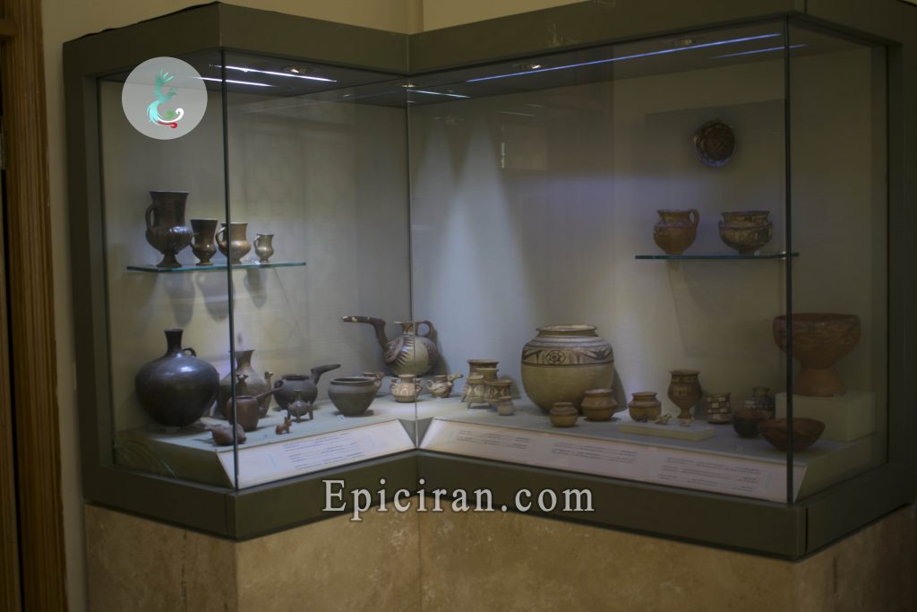 ancient bowls and cups in a showcase in moghadam museum in tehran