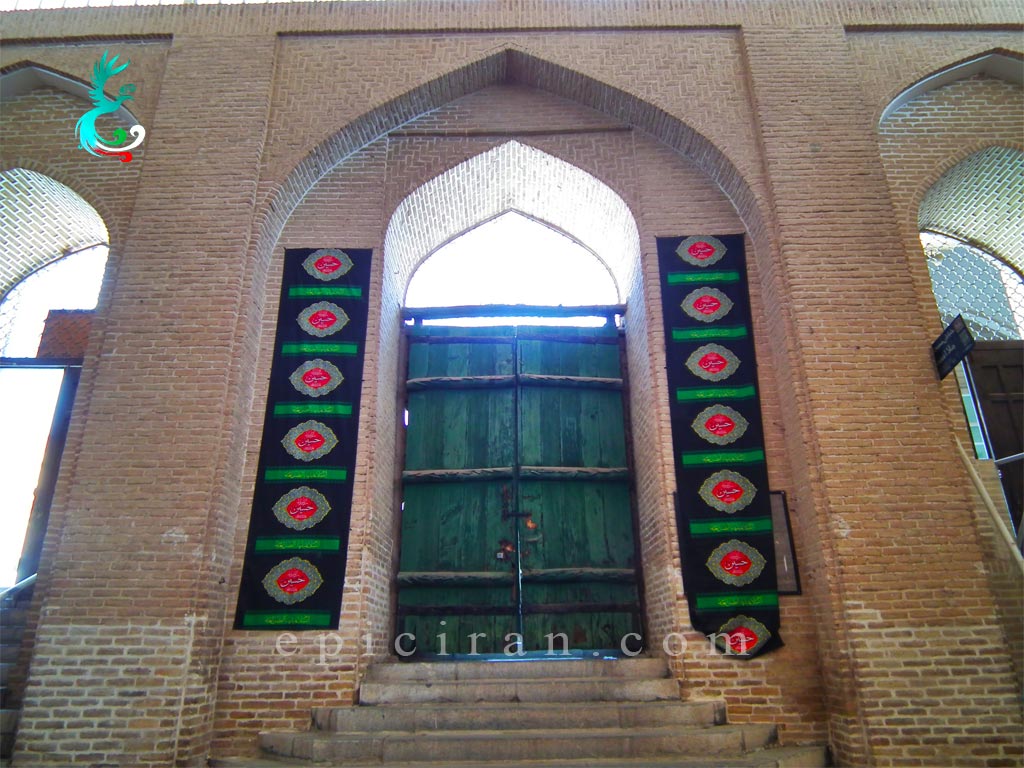 the old green door of Mulla Ismael Mosque in Yazd