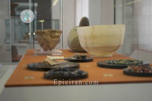 some ancient objects in a showcase in national museum of iran
