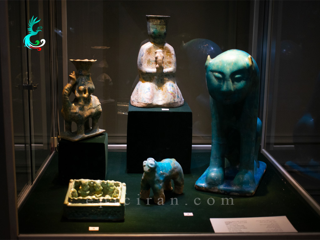 ancient objects with different colors and shapes in a showcase in reza abbasi museum in tehran