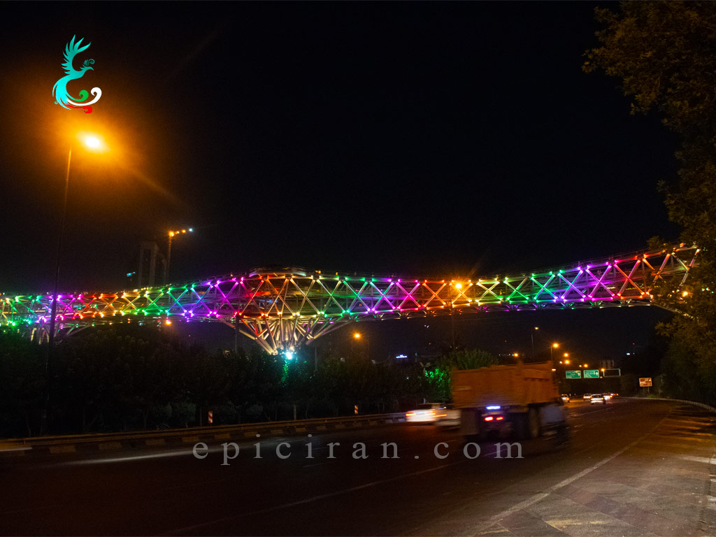 long view of colorful lights of tabiat bridge in tehran at night