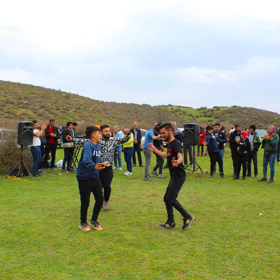 people dancing in the nature and celebrate Sizdah be-dar